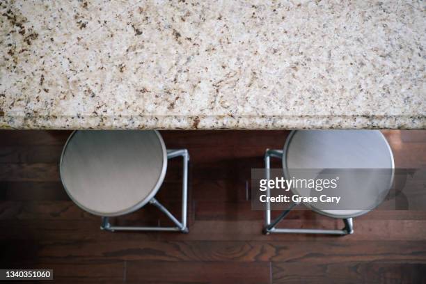 steel counter stools at kitchen island - polished granite stock pictures, royalty-free photos & images