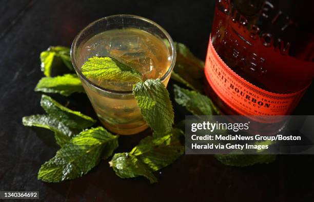 Sheila Gill, manager of Gather food and drink at innovation district hall, shows off a Mint Julep which will be featured at a Kentucky Derby Viewing...