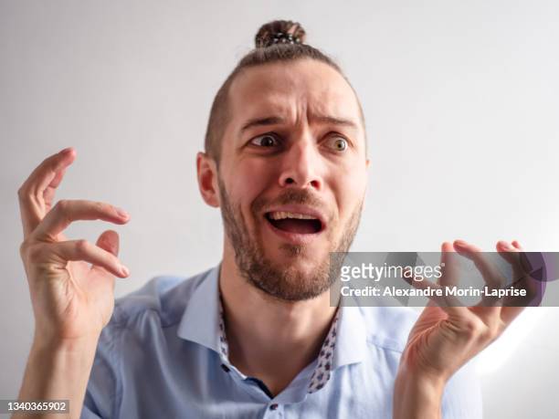 white young man looks sad, stressed and confused - man open mouth stock pictures, royalty-free photos & images