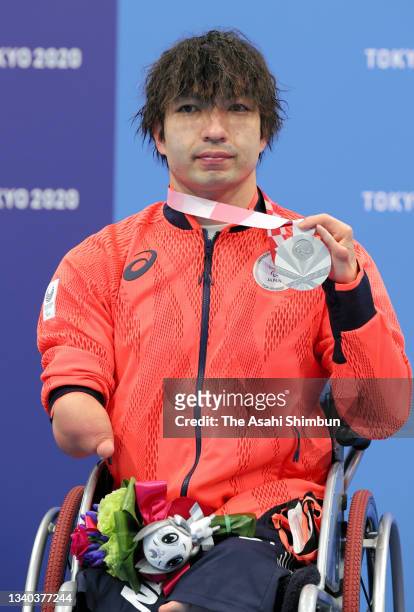 Silver medalist Takayuki Suzuki of Team Japan poses on the podium at the medal ceremony for the Swimming Men's 200m Freestyle - S4 on day 6 of the...