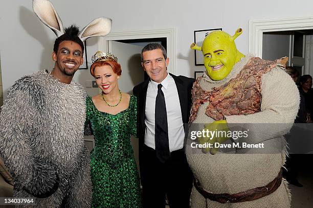 Actor Antonio Banderas poses with the cast members Richard Blackwood, Kimberley Walsh and Nigel Lindsay of 'Shrek The Musical' at a photocall to...
