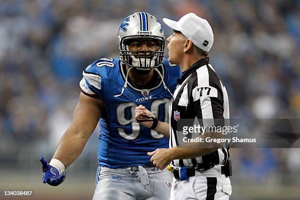 Defensive end Ndamukong Suh of the Detroit Lions argues with referee Terry McAulay after Suh is ejected from the game for unsportsmanlike conduct in...