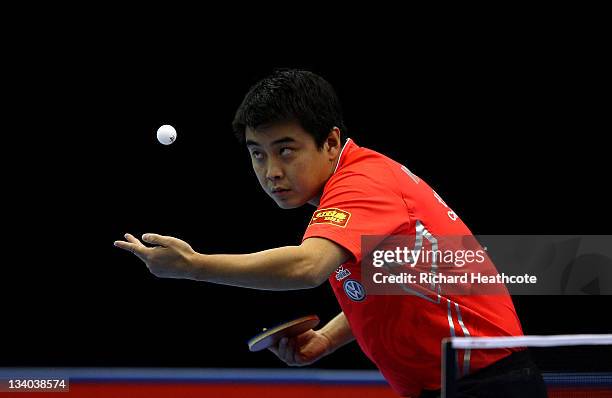 Hao Wang of China serves to Paul Drinkhall of England in the Men's Singles during the ITTF Pro Tour Table Tennis Grand Finals at the ExCel on...