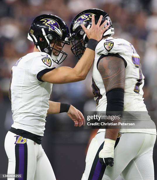 Kicker Justin Tucker and offensive tackle Ronnie Stanley of the Baltimore Ravens celebrate after a field goal against the Las Vegas Raiders during...