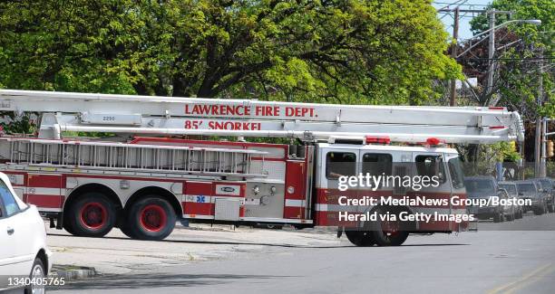 Ladder truck leaves the main station on Lowell Street. The City of Lawrence is facing budget cuts due to reorganization at City Hall. Police and Fire...