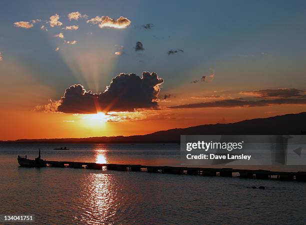 pier in sea at sunset - negros occidental stock pictures, royalty-free photos & images