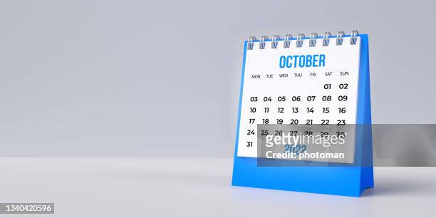 blue october desk calendar 2022 on blank background with copy space. - october stock pictures, royalty-free photos & images