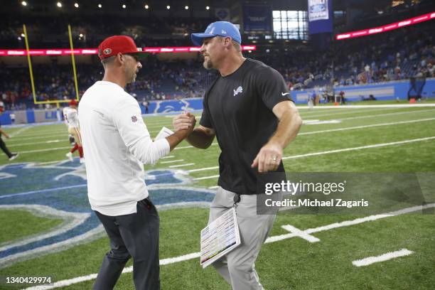 Head Coach Kyle Shanahan of the San Francisco 49ers shakes hands with Head Coach Dan Campbell of the Detroit Lions after the game at Ford Field on...