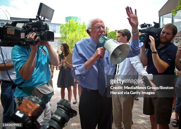 Vermont Senator Bernie Sanders, Democratic candidate for President, speaks through a megaphone to an overflow crowd that gathered in a nearby park...