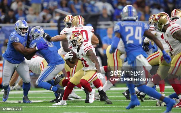 Raheem Mostert of the San Francisco 49ers rushes during the game against the Detroit Lions at Ford Field on September 12, 2021 in Detroit, Michigan....