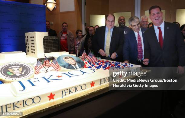 John. F. Kennedy Library acting director James Roth, Kennedy Library Foundation executive director Steve Rothstein, and Boston Mayor Martin Walsh cut...