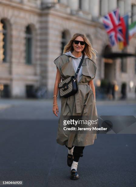 SoSue wearing Celine black loafer, Tol shades, Gucci bag and SoSue beige veste, black pants and grey SoSue sweater on September 09, 2021 in Berlin,...