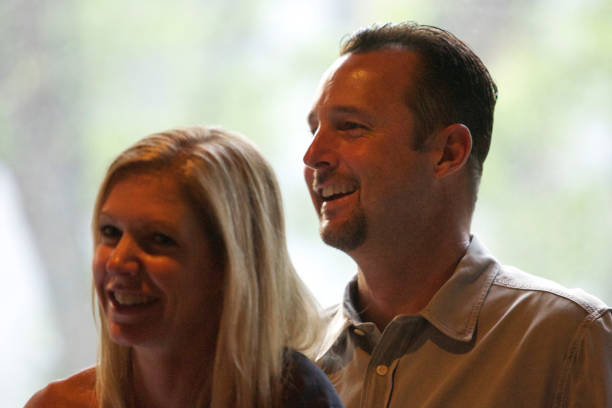 Red Sox pitcher Tim Wakefield and wife Stacy laugh during the comedy portion of the Pitching in for Kids benefit at Ned Devine's in Faneuil Hall on...