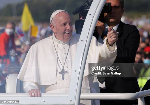Pope Francis rides his Pope mobile through a crowd of pilgrims before holding an open-air mass on September 15, 2021 in Sastin, Slovakia. Today's...