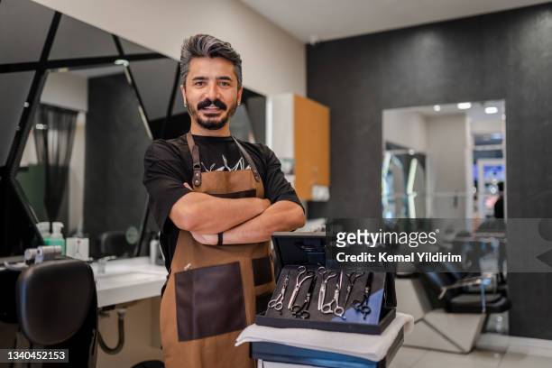 portrait of a barber - salon owner stock pictures, royalty-free photos & images