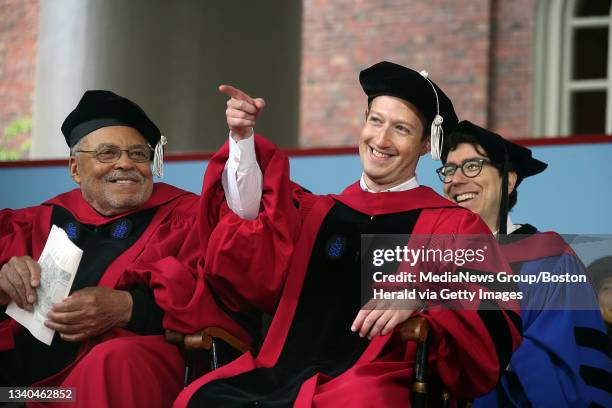 Facebook CEO and Harvard dropout Mark Zuckerberg points to the crowd as actor James Earl Jones looks on while seated on stage during during...