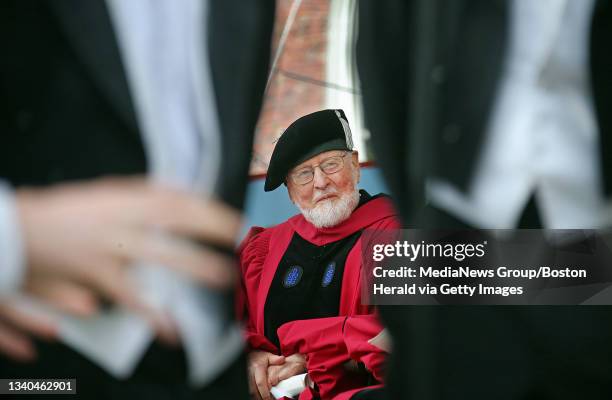 Composer John Williams listens to the "Din and Tonics" a capella group as they sang for Williams' honorary Doctor of Music degree during commencement...