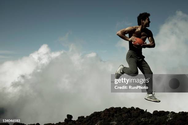 young man training in the mountain,rugby - rugby shizuoka stock-fotos und bilder