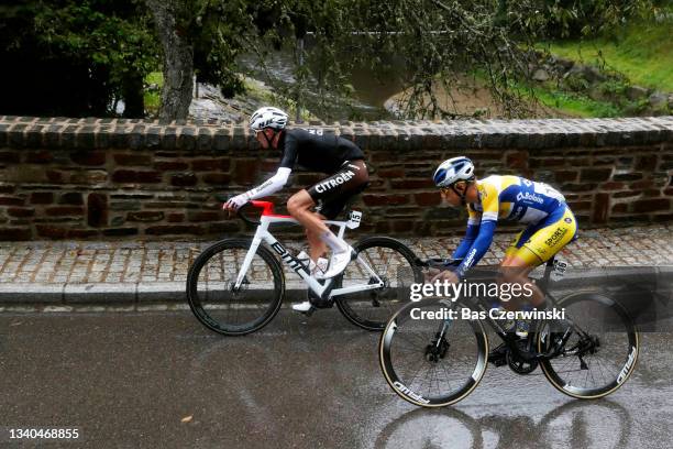 Ben Alexander O'connor of Australia and AG2R Citröen Team and Kenneth Van Rooy of Belgium and Team Sport Vlaanderen - Baloise compete in the rain...