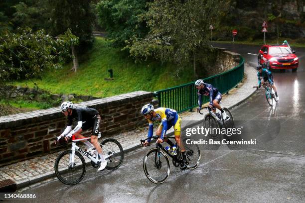 Ben Alexander O'connor of Australia and AG2R Citröen Team and Kenneth Van Rooy of Belgium and Team Sport Vlaanderen - Baloise compete in the rain...