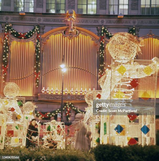 View of Christmas decorations on the promenade at Rockefeller Center in midtown Manhattan, New York, New York, December 1969. Also visible are...