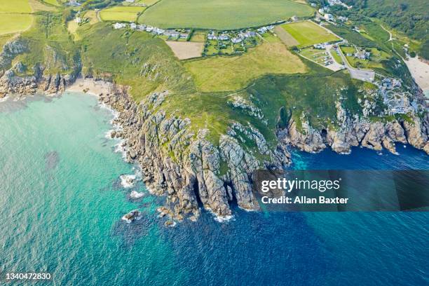 aerial view of porthcurno with the minack theatre in south cornwall - minack theatre stock pictures, royalty-free photos & images