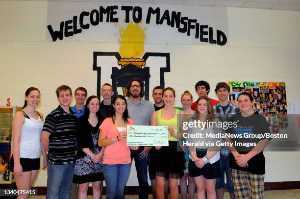 Mansfield High School was the winner of the Ernie Boch's Music Drives Us competition. Ernie Boch with some of the students in the Mansfield High...