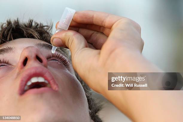 Volunteer firefighter uses eyedrops at the command centre as a bush fire threatens homes on Western Australia's southwest coast on November 24, 2011...