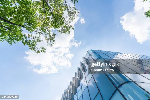 bottom view of modern green city - buildings looking up stockfoto's en -beelden