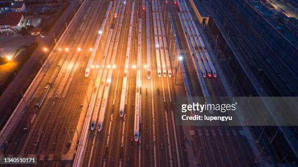 aerial view of high-speed train at night - high speed train ストックフォトと画像