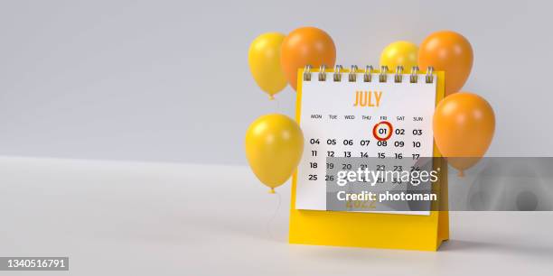 yellow 1st july doctor's day desk calendar 2022 with ballons on blank background with copy space. - calender day 1 stock pictures, royalty-free photos & images