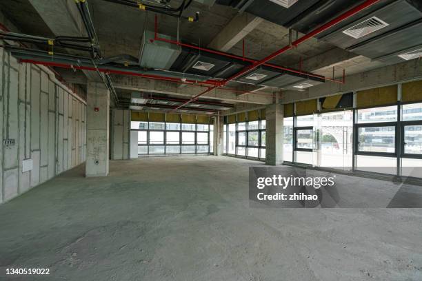 unfinished concrete office building interior view - fire sprinkler stock pictures, royalty-free photos & images