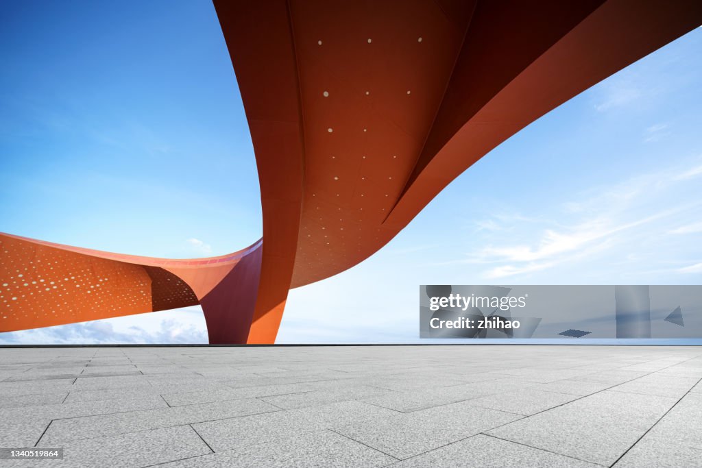 Red abstract decorative buildings and empty squares on sunny days