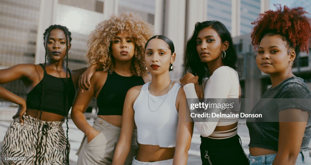 Shot of a diverse group of women posing in the city together during the day