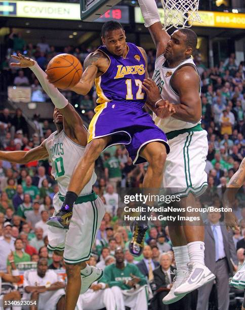 Los Angeles Lakers guard Shannon Brown goes up between Boston Celtics guard Ray Allen and forward Glen Davis during the fourth quarter of the NBA...