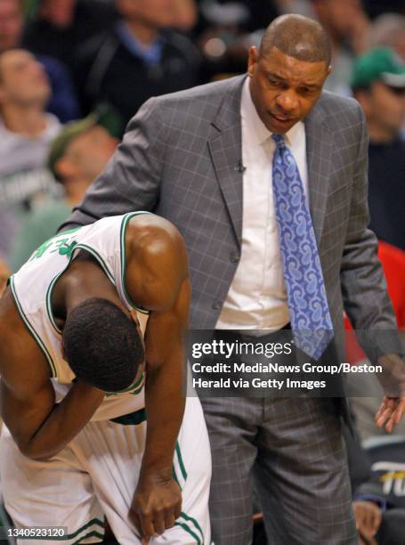 Celtics Head Coach Doc Rivers tends to Boston Celtics guard Tony Allen after getting hurt in the throat during the fourth quarter of the NBA Finals...