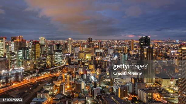 osaka japan illuminated downtown cityscape panorama at sunset - osaka city 個照片及圖片檔