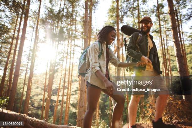 forest walk and camping adventures - interracial couple stock pictures, royalty-free photos & images