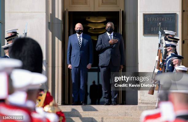 Secretary of Defense Lloyd Austin and Australian Minister for Defense Peter Dutton stand for their national anthems during an honor cordon at the...