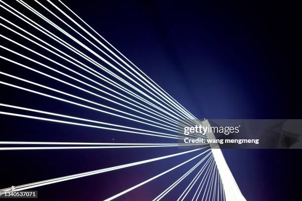 cable-stayed bridge at night - bridge architecture up close night stock pictures, royalty-free photos & images