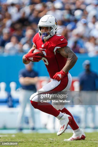 James Conner of the Arizona Cardinals runs the ball against the Tennessee Titans at Nissan Stadium on September 12, 2021 in Nashville, Tennessee.