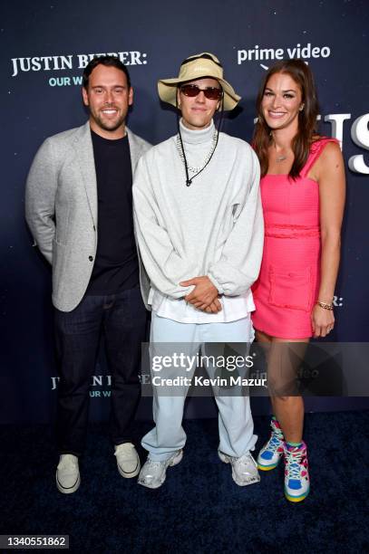 Scooter Braun, Justin Bieber, and Allison Kaye attend the Justin Bieber: Our World event at The Edge at Hudson Yards on September 14, 2021 in New...