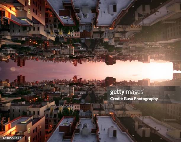 capsized reflected image of horizon at sunset over rooftops in harlem, new york city - stunning early color photography stockfoto's en -beelden