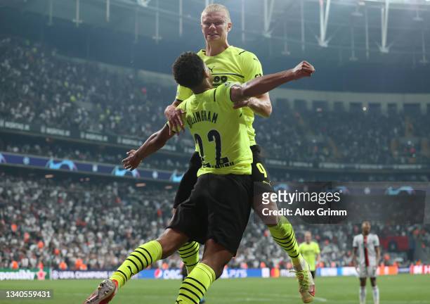 Erling Haaland of Borussia Dortmund celebrates with teammate Jude Bellingham after scoring their side's second goal during the UEFA Champions League...
