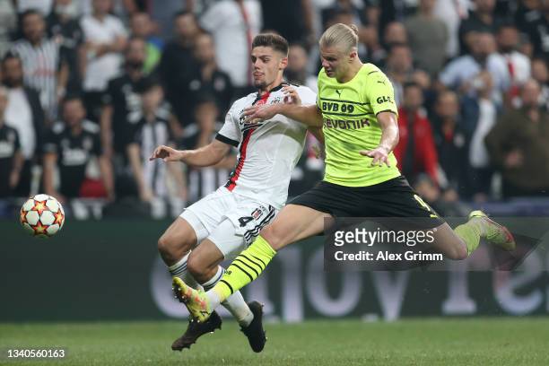 Erling Haaland of Borussia Dortmund and Francisco Montero of Besiktas battle for the ball during the UEFA Champions League group C match between...