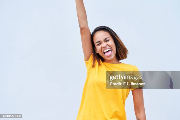 portrait of woman dancing on white background - funny face stock pictures, royalty-free photos & images