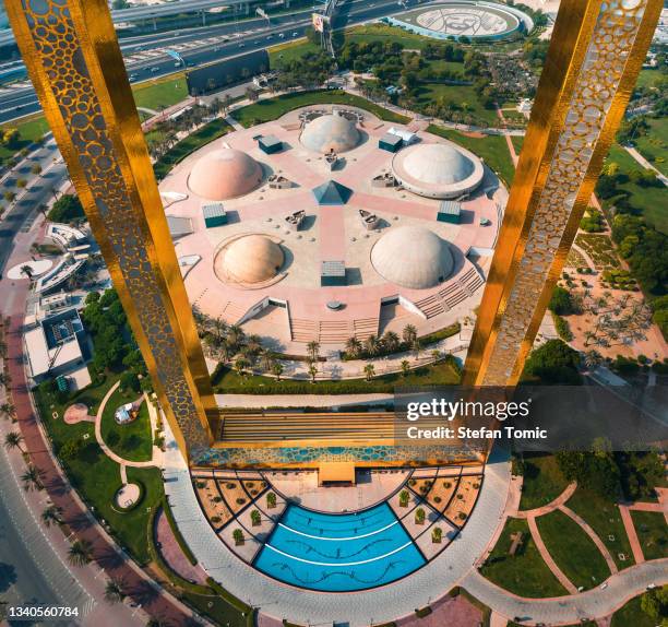 top aerial view of dubai frame and zabeel public park near downtown dubai in the united arab emirates - dubai frame stockfoto's en -beelden