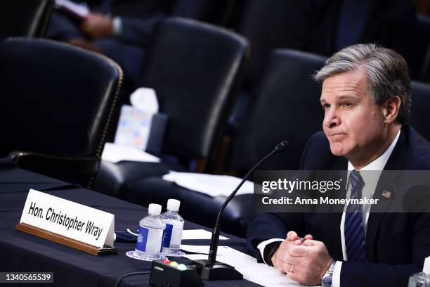 Director Christopher Wray listens during a Senate Judiciary hearing about the Inspector General's report on the FBI handling of the Larry Nassar...