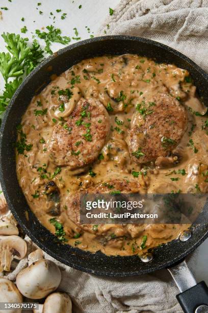 pork tenderloin medallions in a creamy mushroom sauce - savoury sauce stock pictures, royalty-free photos & images