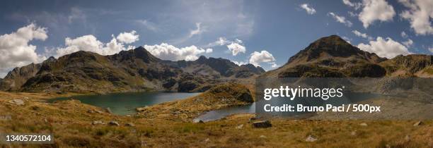 panoramic view of lake and mountains against sky,etang de fontargentes,france - grand etang lake stock pictures, royalty-free photos & images